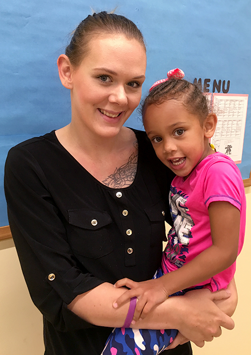 Ashley Horn picks up her daughter, Icess, from preschool.