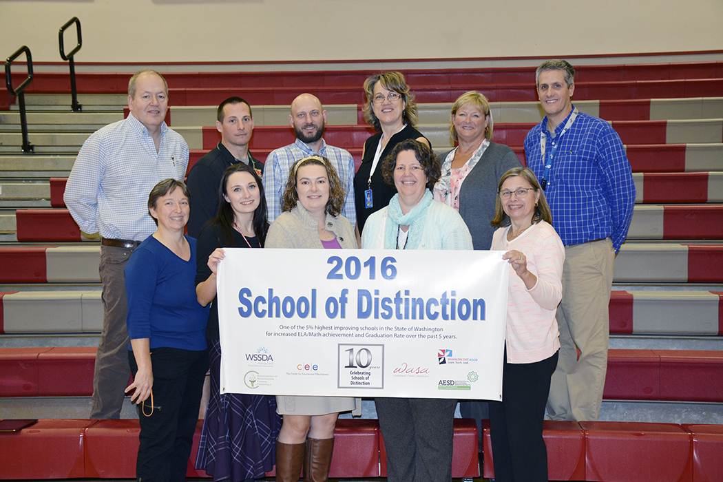 CCMS staff with School of Distinction banner