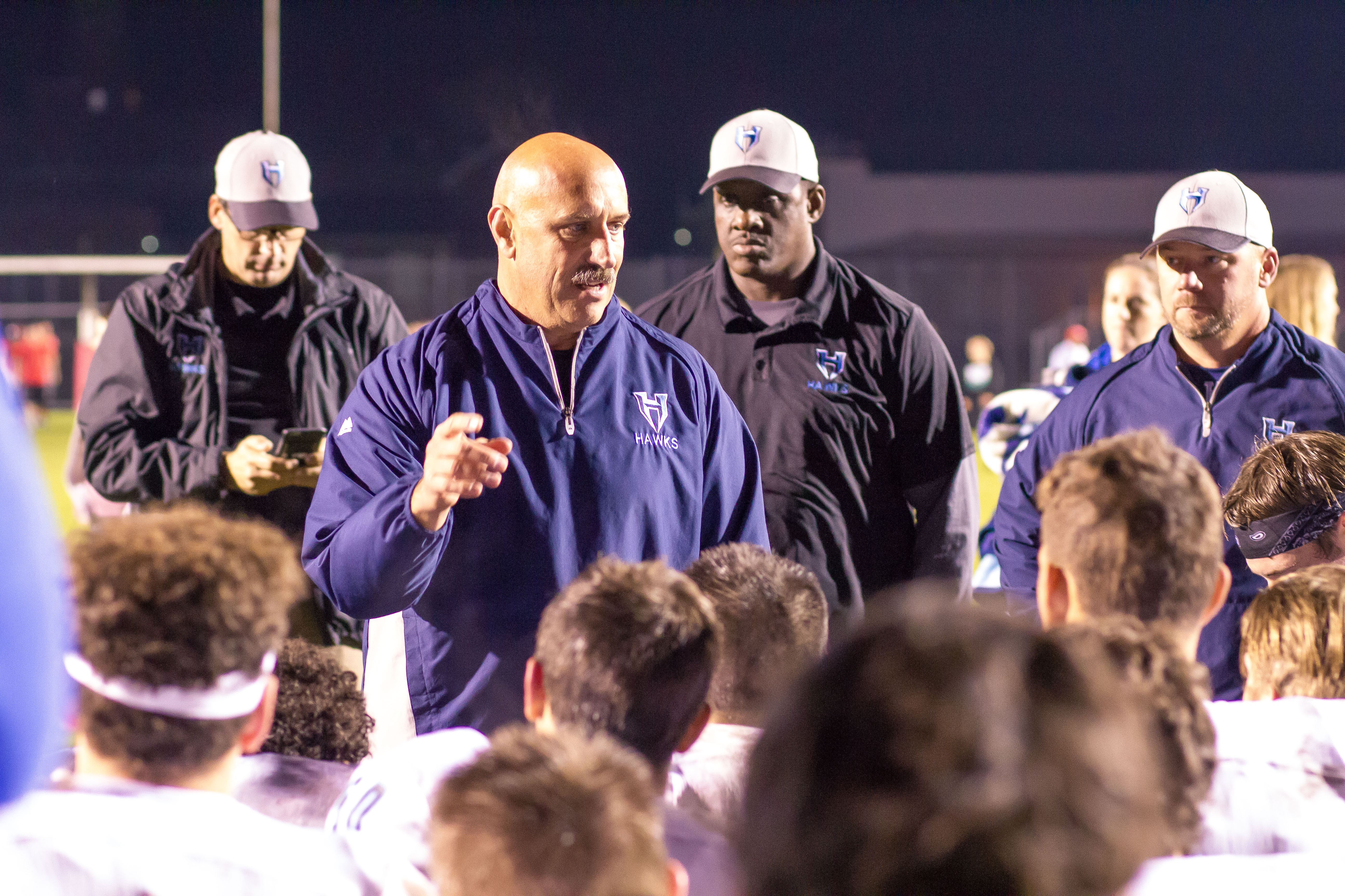 Hockinson coach Rick Steele talks to football team