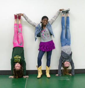 Alexis Caughell (sixth grade), Grace Reister (fifth grade) and Lily Wear (fifth grade) joined "Girl Talk and Tennies" to make friends and be active.