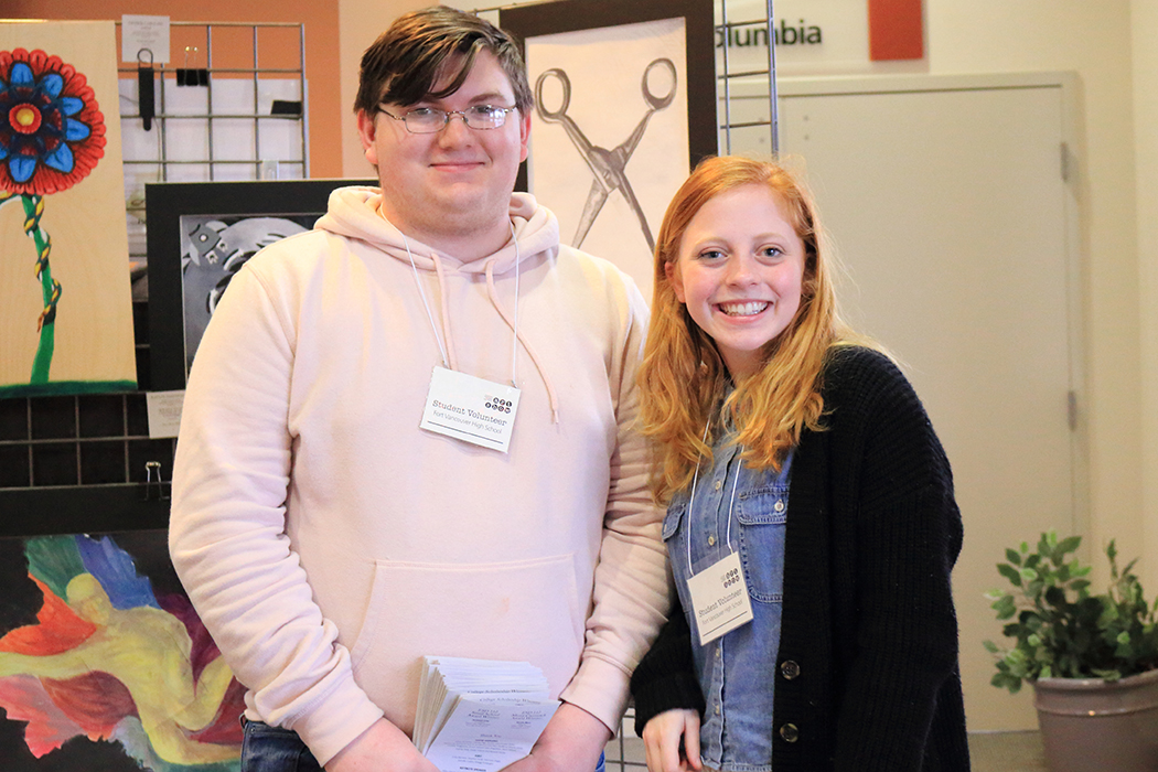 Student volunteers from Fort Vancouver High School hand out programs at the Gallery Opening and Reception.