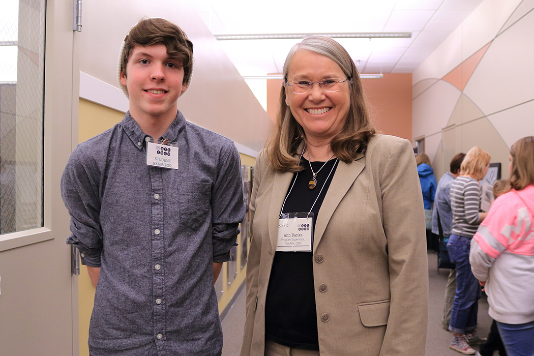 OSPI Program Supervisor for the Arts, Anne Banks with a student exhibitor.