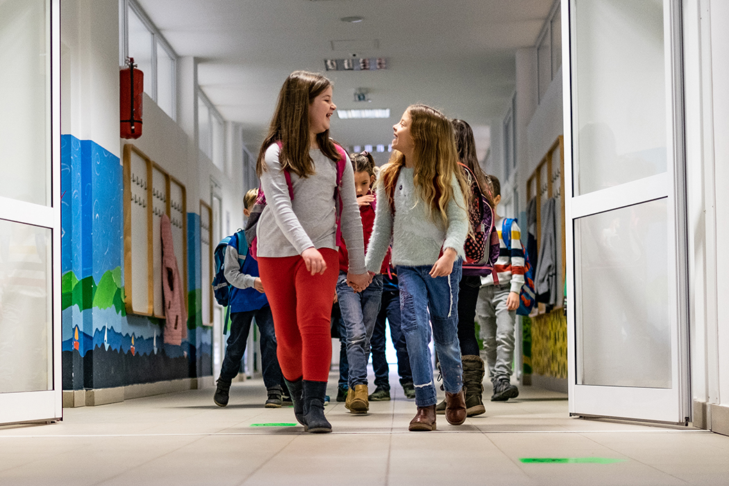 kids walking down a school hallway
