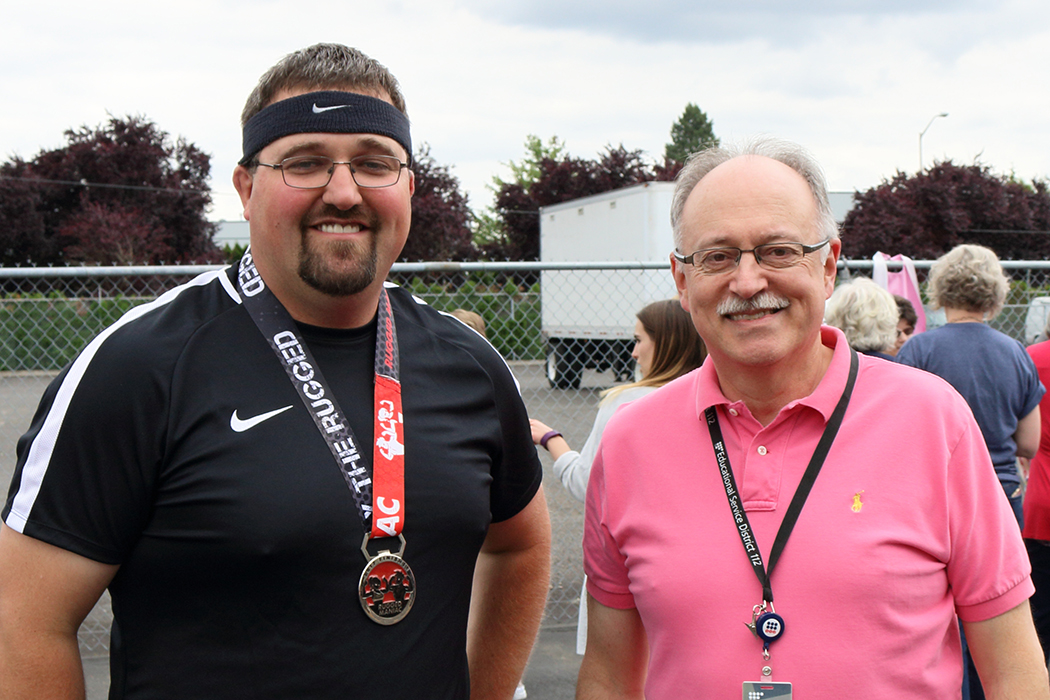 CFO Gavin Hottman and Superintendent Tim Merlino celebrating ESD 112's successes at the end-of-the-year party in June.