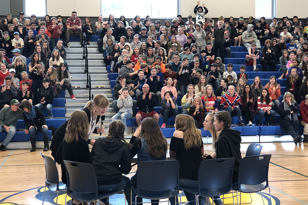 The HMS student body cheers for their classmates the Picky Readers competing against the Stupendous Staff in the final book battle on March 1.
