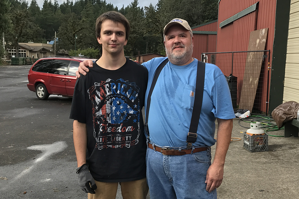 Stevenson High School volunteer Codie Livingston with community volunteer Coby Wright at the animal shelter.