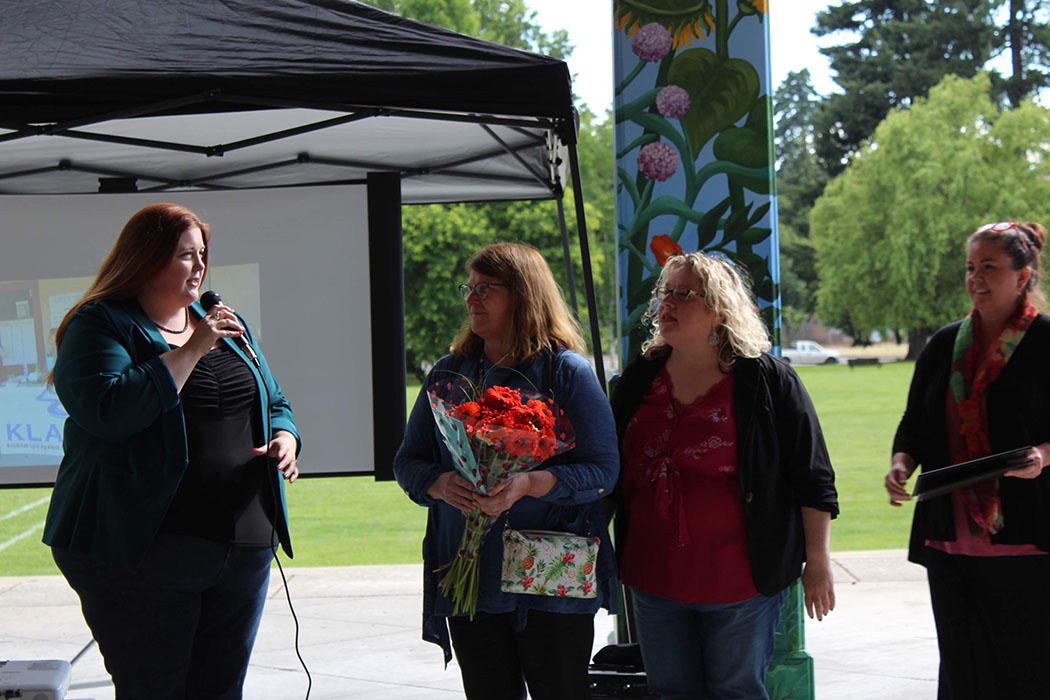 Delena Meyer and Missy Cummins from Connect Evergreen Coalition honor Wendy Silverthorne, Coordinator, as she retires from Evergreen School District and coalition work.