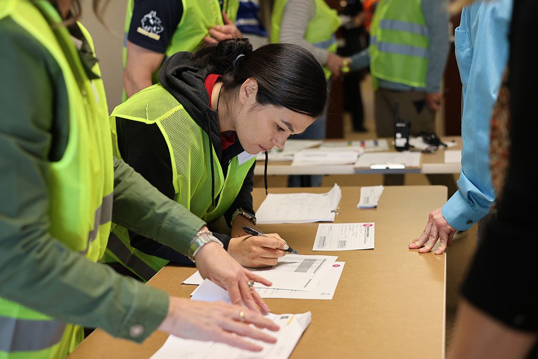 Participants check parents in at simulated Family Assistance Center