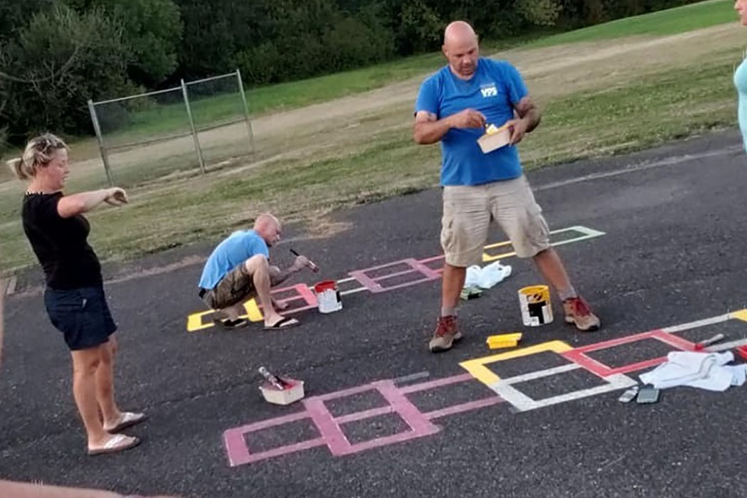 Volunteers makeover playground at South Ridge Elementary School