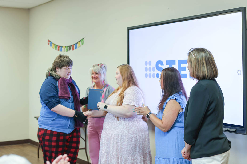 STEPS graduate Jasen receiving diploma