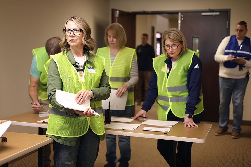 School staff simulate a family check-in area at a Family Assistance Center