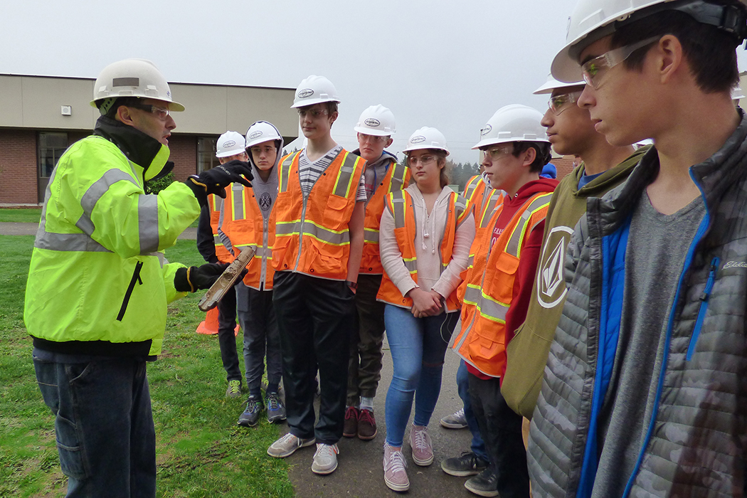 Ridgefield High School engineering students observe the geological field work taking place on campus