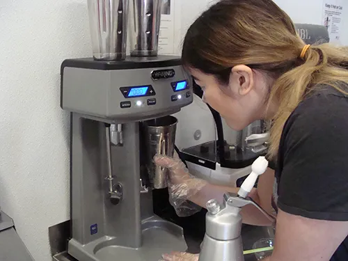 Student making milkshake