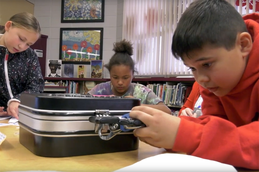 Sifton Elementary students working puzzle boxes